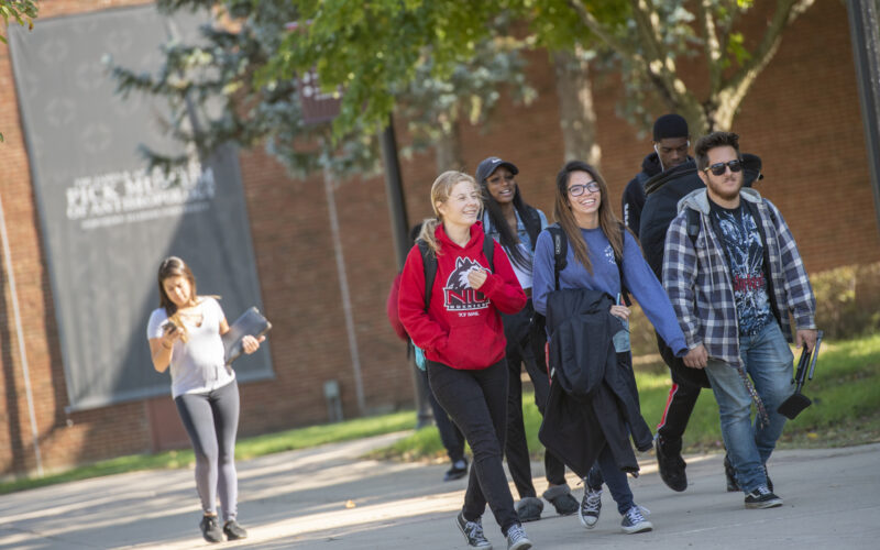 group of students walking on NIU's campus