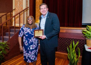 Jason Rhode accepts the SPS Award for Partnership and Collaboration at the Spring 2022 Staff Awards Recognition