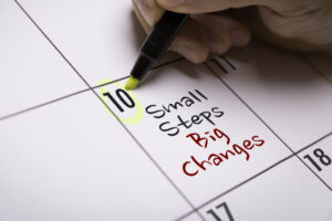 Calendar with "Small steps, big changes" written on it. 