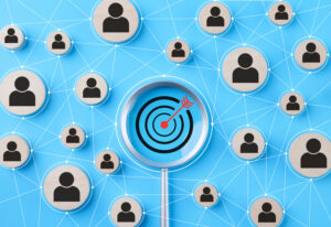Graphic illustration of customer profiles connected to a target, representing customer relationship management and targeted marketing strategies.