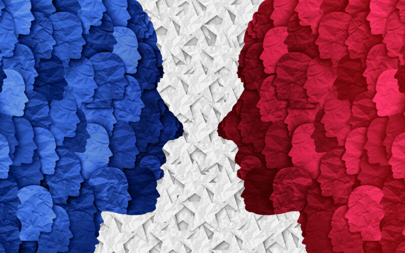 Concept of divided American political groups and United States between conservative and liberal ideas. Blue silhouette facing red silhouette.