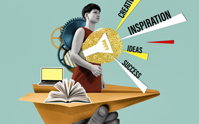 Concept of creativity, inspiration, ideas. Person holding lightbulb under arm with inspiration words branching off it. Person is on top of a large paper airplane held by a disembodied hand. Also on the airplane are a laptop and open book.