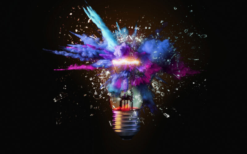 Creative colored light bulb explosion with shards and paint, a creative idea.