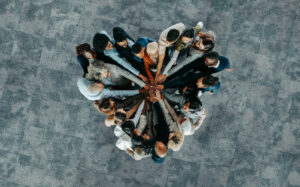 Top view of a a heart shape of people, showing unity and teamwork