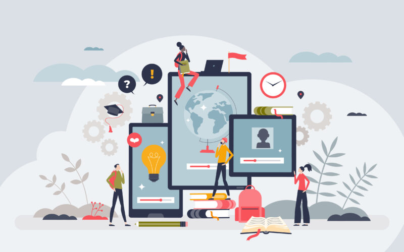 Illustration of several students interacting with large digital devices (a laptop, tablet, and phone) displaying learning content, with icons such as a globe, lightbulb, graduation cap, and books around them. The scene represents online learning and educational technology, with students studying, collaborating, and accessing course materials in a digital environment.