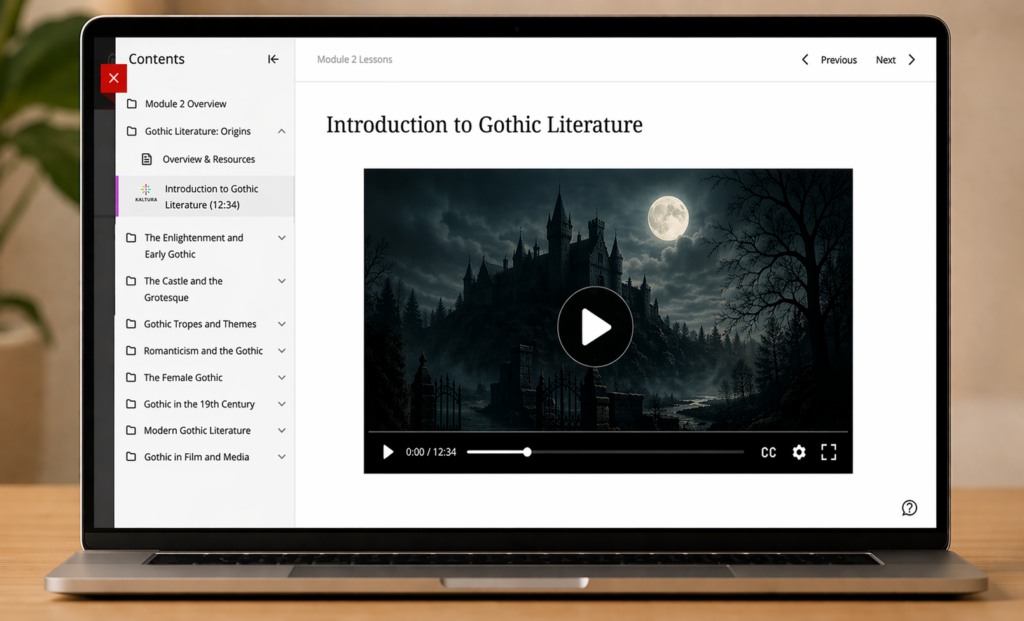 A laptop sits on a wooden desk displaying a learning management system page labeled “Module 2 Lessons.” The main heading reads “Introduction to Gothic Literature (12:34).” In the center, a video player shows a dark image of a Gothic castle at night under a full moon, with playback controls and a timestamp bar visible. On the left, a simplified “Contents” sidebar lists literature-focused modules, including “Module 2 Overview,” “Gothic Literature: Origins,” and several subtopics. Under “Gothic Literature: Origins,” a selected item with a small multicolored Kaltura icon reads “Introduction to Gothic Literature (12:34).” Navigation buttons for “Previous” and “Next” appear in the top right.